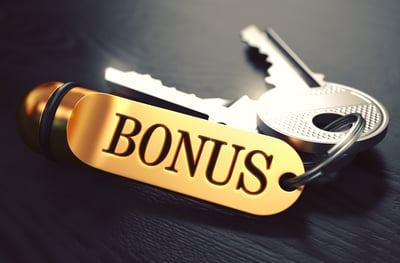 Bonus - Bunch of Keys with Text on Golden Keychain. Black Wooden Background. Closeup View with Selective Focus. 3D Illustration. Toned Image.