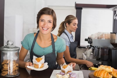 Pretty waitresses working with a smile at the coffee shop